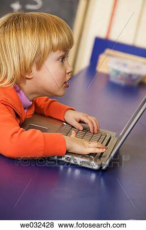 4 year old Caucasian girl and laptop View Large Photo Image Stock Photo - 4 year old Caucasian girl and laptop. Fotosearch