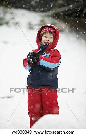 4 year old girl making snowballs View Large Photo Image Stock Photo - 4 year old girl making snowballs. Fotosearch