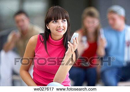 adolescence, communication, cell phone, absorbed View Large Photo Image Stock Photo - adolescence, communication, cell phone, absorbed. Fotosearch