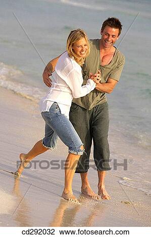 affection, beach, barefoot, amusement, 30's View Large Photo Image Stock Image - affection, beach, barefoot, amusement, 30's. Fotosearch