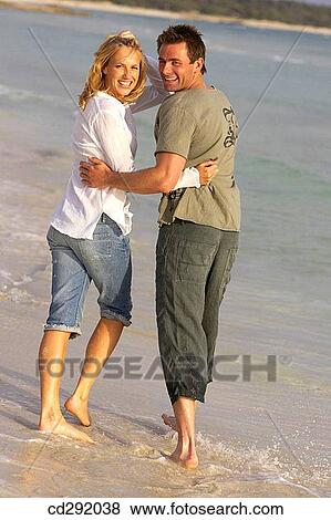 affection, bond, beach, barefoot, 30's View Large Photo Image Stock Photo - affection, bond, beach, barefoot, 30's. Fotosearch