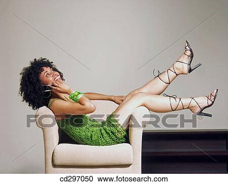 afro girl talking on cell phone View Large Photo Image Stock Image - afro girl talking on cell phone. Fotosearch