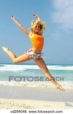 agility, blond, beach, Arms raised, agile View Large Photo Image Stock Photo - agility, blond, beach, Arms raised, agile. Fotosearch