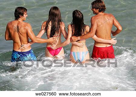 Stock Image - amusement, bathe, back view, 20's. Fotosearch