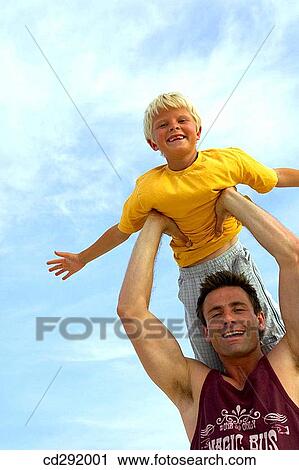 amusement, boy, Arms raised, 30's View Large Photo Image Stock Image - amusement, boy, Arms raised, 30's. Fotosearch
