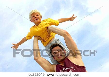 amusement, boy, Arms raised, 30's View Large Photo Image Stock Photo - amusement, boy, Arms raised, 30's. Fotosearch