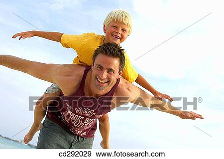 amusement, boy, beach, Arms open, 30's View Large Photo Image Stock Photo - amusement, boy, beach, Arms open, 30's. Fotosearch