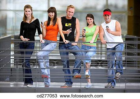 Stock Image - amusement, cell phone, boy, adolescence. Fotosearch