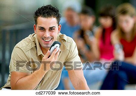 Stock Photo - amusement, cell phone, boy, adolescence. Fotosearch