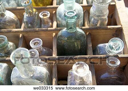 Antique bottles in wooden box View Large Photo Image Stock Photography - Antique bottles in wooden box. Fotosearch