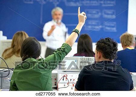 Arm raised, classroom, Attracting attention, adolescence View Large Photo Image Stock Photography - Arm raised, classroom, Attracting attention, adolescence. Fotosearch