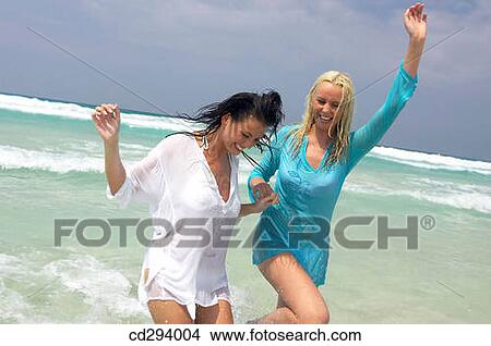 Arms raised, beach, bathing, bathe, amusement View Large Photo Image Picture - Arms raised, beach, bathing, bathe, amusement. Fotosearch