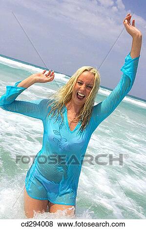 Arms raised, beach, bathing, bathe, amusement View Large Photo Image Stock Photo - Arms raised, beach, bathing, bathe, amusement. Fotosearch