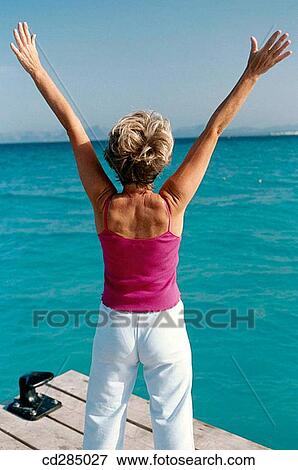 Arms raised, calisthenics, back view, Arms open View Large Photo Image Stock Photo - Arms raised, calisthenics, back view, Arms open. Fotosearch