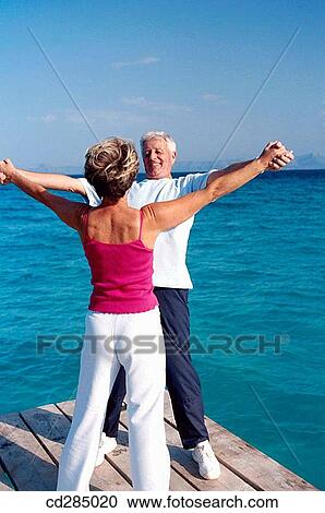 Arms raised, calisthenics, bonding, bond, Arms open View Large Photo Image Stock Image - Arms raised, calisthenics, bonding, bond, Arms open. Fotosearch