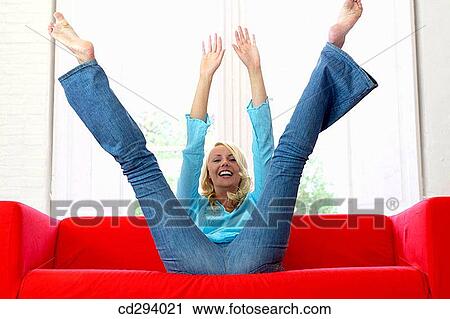 Arms raised, carefree, barefoot, at-home, 30's View Large Photo Image Stock Image - Arms raised, carefree, barefoot, at-home, 30's. Fotosearch
