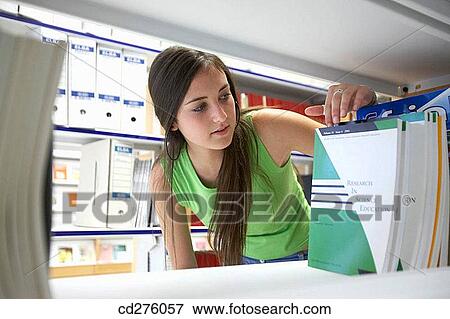 Stock Photo - arrangement, college, bookcase, book, adolescence. Fotosearch