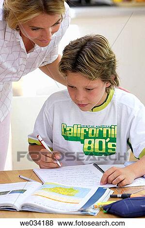 Stock Photo - at-home, boy, book, aid. Fotosearch