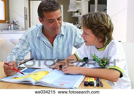Stock Photography - at-home, boy, book, aid. Fotosearch