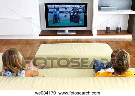 Stock Image - at-home, brother, boy, back view, addiction. Fotosearch