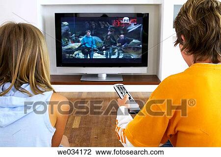 Stock Image - at-home, brother, boy, back view, addiction. Fotosearch