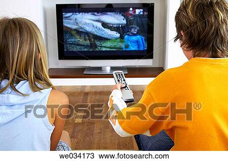 Stock Image - at-home, brother, boy, back view, addiction. Fotosearch