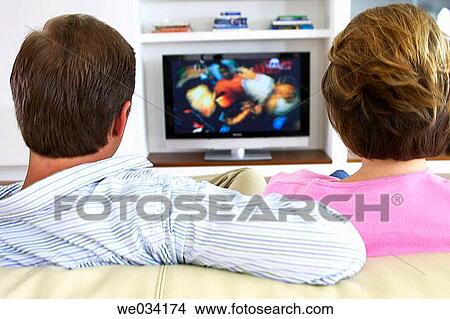 Picture - at-home, contemporary, back view, addiction. Fotosearch