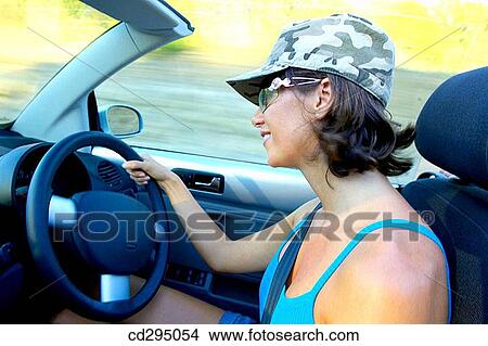 automobile, car, cap, brunette, 30's View Large Photo Image Picture - automobile, car, cap, brunette, 30's. Fotosearch