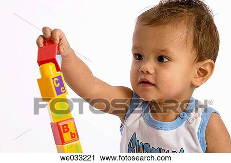 Baby boy playing with brics. View Large Photo Image Stock Image - Baby boy playing with brics.. Fotosearch