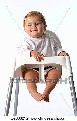 Baby girl in baby-chair. View Large Photo Image Stock Image - Baby girl in baby-chair.. Fotosearch