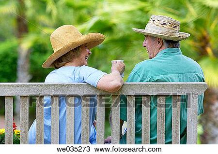 Stock Image - back view, bench, break, break-time, calm. Fotosearch