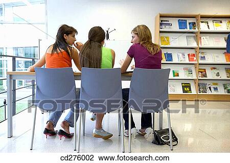 Stock Image - back view, college, chat, adolescence. Fotosearch