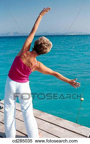 Stock Photography - back view, contemporary, calisthenics, Arms open. Fotosearch