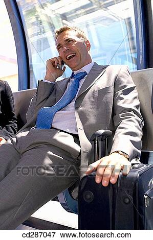 Stock Photo - baggage, bench, business, Business travel, businessman. Fotosearch