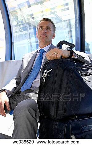 baggage, Business travel, business, bench, absorbed View Large Photo Image Stock Photo - baggage, Business travel, business, bench, absorbed. Fotosearch