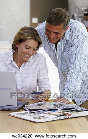 Stock Image - Bank card, catalogue, at-home. Fotosearch