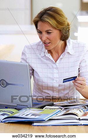 Bank card, catalogue, at-home View Large Photo Image Stock Photo - Bank card, catalogue, at-home. Fotosearch