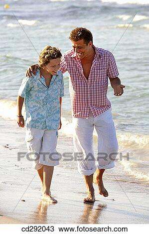 barefoot, bonding, bond, beach, affection View Large Photo Image Stock Image - barefoot, bonding, bond, beach, affection. Fotosearch