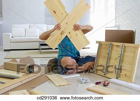 Stock Photograph - barefoot, cross, contemporary, at-home. Fotosearch