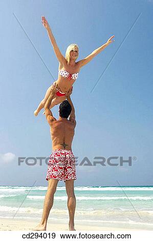 Stock Photo - beach, Arms raised. Fotosearch