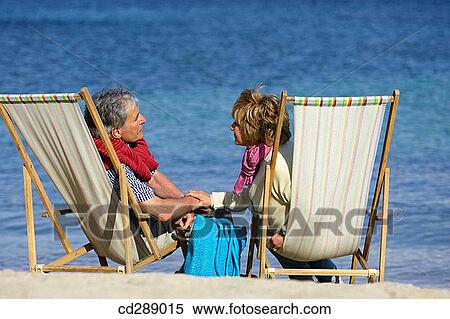 Stock Photography - beach, bonding, bond, beach chair, affection. Fotosearch