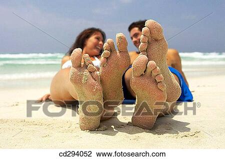 Stock Image - beach, calm, contemporary, couple. Fotosearch
