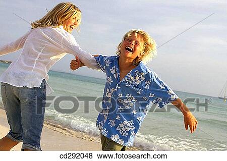 beach, carefree, boy, 30's View Large Photo Image Stock Photo - beach, carefree, boy, 30's. Fotosearch