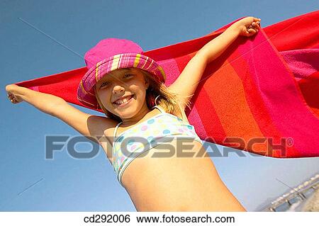 Stock Photograph - beach, child, Arms raised. Fotosearch