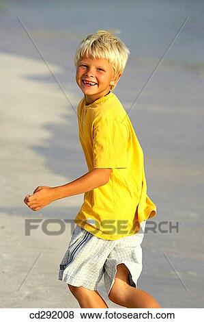 Stock Photo - beach, child, boy, blond, amusement. Fotosearch