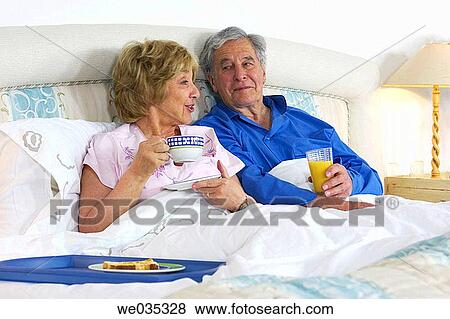 Stock Photo - bed, calm, breakfast, bedroom, at-home. Fotosearch