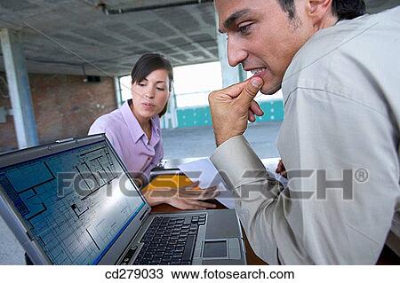 Stock Image - blueprint, businesspeople, businessman, business, 30's. Fotosearch