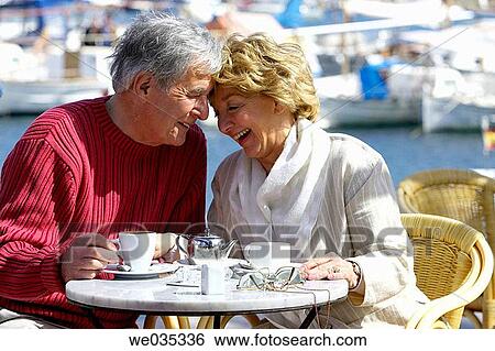 Stock Photograph - bond, Cafe terrace, breakfast, bonding, affection. Fotosearch