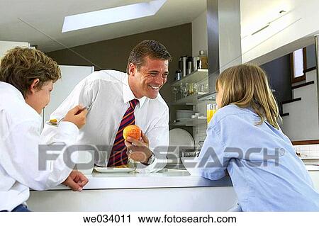 Stock Image - boy, brother, breakfast, at-home. Fotosearch