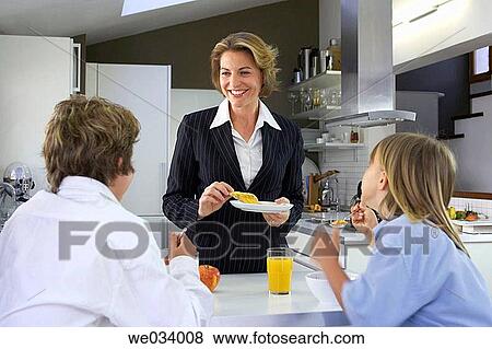 Stock Photo - boy, business, brother, breakfast, at-home. Fotosearch